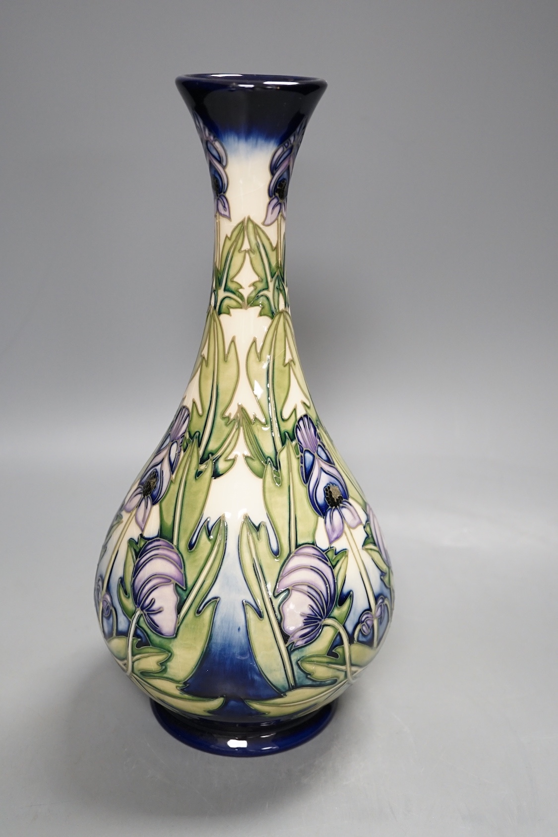 A Moorcroft 'wolfsbane' vase by Anji Davenport, 8.11.01, 99/350, 30 cms high.